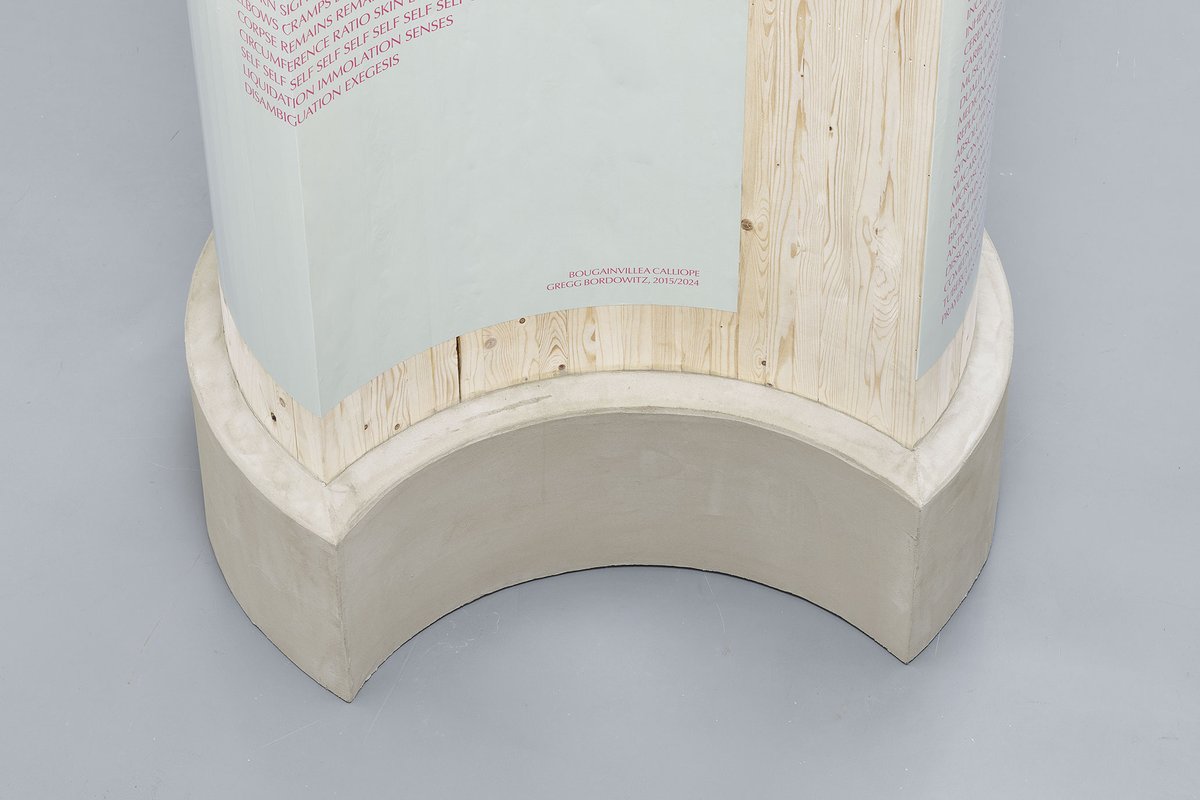 Gregg Bordowitz, Säule II (detail), 2024, wood, cement, posters, 441 x 150 cm (Ø). Photo: Mareike Tocha